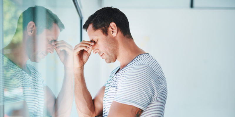 man stressed with head in hand - The Meadows Malibu